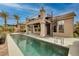 Backyard pool with a spa and patio, and a spiral staircase leading to a rooftop deck at 1342 Calle Calma, Henderson, NV 89012