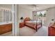Bedroom featuring light walls, one window, carpeted floors, and vintage wood furniture at 1409 Chambolle Ct, Las Vegas, NV 89144