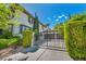 Elegant two-story home featuring a gated entrance and meticulously maintained landscaping at 1409 Chambolle Ct, Las Vegas, NV 89144