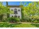 Charming two-story stucco home with meticulously manicured lawn and lush landscaping creates curb appeal at 1409 Chambolle Ct, Las Vegas, NV 89144