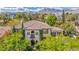 Lush landscaping surrounds this beautiful two-story home with a tile roof at 1409 Chambolle Ct, Las Vegas, NV 89144