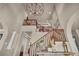 Grand foyer featuring soaring ceilings, a decorative staircase, and ornate details throughout at 1409 Chambolle Ct, Las Vegas, NV 89144