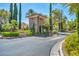 Charming stone gatehouse at the community entrance, surrounded by lush trees and clear signage at 1409 Chambolle Ct, Las Vegas, NV 89144
