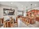 Bright eat-in kitchen featuring a large island, granite countertops, stainless steel appliances, and rustic wooden chairs at 1409 Chambolle Ct, Las Vegas, NV 89144