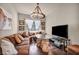 Cozy living room features a comfortable sofa, unique lighting, and warm decor, creating a welcoming atmosphere at 1409 Chambolle Ct, Las Vegas, NV 89144