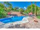 Backyard pool with a spa, mature landscaping, and plenty of room to relax and enjoy the outdoors at 1409 Chambolle Ct, Las Vegas, NV 89144