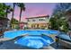 Resort-style backyard with a sparkling pool, hot tub, and covered patio, perfect for outdoor entertaining at 1409 Chambolle Ct, Las Vegas, NV 89144