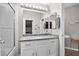 Bright bathroom showcasing a white vanity with chrome fixtures and a shower/tub combo at 1922 Pyle, Las Vegas, NV 89183