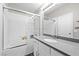 Bathroom featuring a shower-over-tub, white vanity, and chrome fixtures at 1922 Pyle, Las Vegas, NV 89183