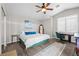 Well-lit bedroom with a queen bed, accent pillows, and a ceiling fan at 1922 Pyle, Las Vegas, NV 89183