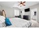 Spacious bedroom featuring a ceiling fan, a desk, and an ensuite bathroom at 1922 Pyle, Las Vegas, NV 89183