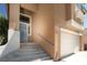 Exterior shot showcasing the home's front entrance, steps, and desert landscaping at 1922 Pyle, Las Vegas, NV 89183