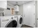 Convenient laundry room equipped with a washer, dryer, and storage cabinets at 1922 Pyle, Las Vegas, NV 89183