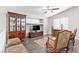 Comfortable living room with vaulted ceilings, plantation shutters, wood floors, and stylish furnishings at 1922 Pyle, Las Vegas, NV 89183