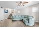 Spacious living room with a large comfortable blue sofa and stairway to the second floor at 1922 Pyle, Las Vegas, NV 89183