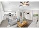 Open-concept living room features recessed lighting, a ceiling fan, a modern kitchen and comfortable seating for guests at 1922 Pyle, Las Vegas, NV 89183