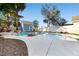 Backyard swimming pool with a rock waterfall feature, desert landscaping and a pool shed at 1922 Pyle, Las Vegas, NV 89183