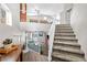A well-lit carpeted staircase leads to the second floor's living area with a pool view at 1922 Pyle, Las Vegas, NV 89183