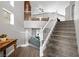 Carpeted staircase and hardwood flooring lead to the second floor's living area with ample natural light at 1922 Pyle, Las Vegas, NV 89183