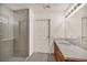 Bathroom featuring tile floors, shower, and white cabinets at 200 W Sahara Ave # 2404, Las Vegas, NV 89102