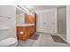 Comfortable bathroom featuring a toilet, wood vanity, and a glass-enclosed shower at 200 W Sahara Ave # 2404, Las Vegas, NV 89102