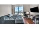 Comfortable bedroom featuring a work space and a large window with great views at 200 W Sahara Ave # 2404, Las Vegas, NV 89102
