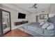 Modern bedroom featuring a queen sized bed, TV, and hard wood floors at 200 W Sahara Ave # 2404, Las Vegas, NV 89102