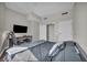 Simple bedroom featuring a work desk and closet space at 200 W Sahara Ave # 2404, Las Vegas, NV 89102