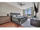 Luxurious bedroom with hardwood floors, modern fan, and city view at 200 W Sahara Ave # 2404, Las Vegas, NV 89102