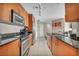 Well-lit kitchen featuring stainless steel appliances and sleek granite countertops at 200 W Sahara Ave # 2404, Las Vegas, NV 89102