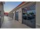 Long view of outdoor bar area and walkway by multi-unit residences with open BBQ and covered roof at 200 W Sahara Ave # 2404, Las Vegas, NV 89102