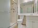 This bathroom features a glass shower enclosure, a toilet, and a vanity with a large mirror at 2007 High Mesa Dr, Henderson, NV 89012