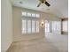 Bright living room with neutral walls, plantation shutters, vaulted ceilings, and carpet flooring at 2007 High Mesa Dr, Henderson, NV 89012