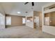 Spacious living room offering carpet flooring, plantation shutters, neutral walls, and open to kitchen at 2007 High Mesa Dr, Henderson, NV 89012