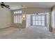 Spacious living room features a vaulted ceiling, neutral walls, and white plantation shutters at 2007 High Mesa Dr, Henderson, NV 89012
