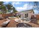 Charming backyard featuring a jacuzzi, patio seating, and a well-maintained landscape at 208 Lynbrook St, Henderson, NV 89012