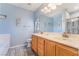 Bathroom with a double sink vanity and light blue walls at 208 Lynbrook St, Henderson, NV 89012