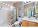 Bathroom with a shower, a toilet, and a sink at 208 Lynbrook St, Henderson, NV 89012