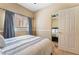 Bedroom featuring a large bed and a closet at 208 Lynbrook St, Henderson, NV 89012
