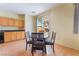 Bright dining area near the kitchen with easy access to the backyard through a sliding glass door at 208 Lynbrook St, Henderson, NV 89012