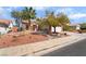 Charming home with a two-car garage, desert landscaping, and a tidy front yard at 208 Lynbrook St, Henderson, NV 89012