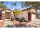 Inviting home with a two-car garage and a walkway leading to the front door at 208 Lynbrook St, Henderson, NV 89012