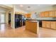 Bright kitchen featuring stainless steel appliances, ample cabinetry, and a functional center island at 208 Lynbrook St, Henderson, NV 89012