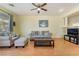 Cozy living room featuring a neutral color scheme, plush seating, and modern ceiling fan at 208 Lynbrook St, Henderson, NV 89012