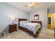 Well-appointed primary bedroom with a comfortable bed and a dresser at 208 Lynbrook St, Henderson, NV 89012