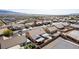 Overview of houses in a neighborhood with desert landscaping and mountain views at 209 Eucalyptus Ln, Mesquite, NV 89027