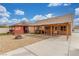 Large backyard with a covered patio, fire pit, and plenty of room for outdoor activities at 209 Eucalyptus Ln, Mesquite, NV 89027