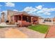 Inviting backyard with covered patio, lush green lawn, and ample space for relaxation at 209 Eucalyptus Ln, Mesquite, NV 89027