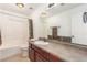 Bathroom with a single sink vanity, bathtub and shower combo and a decorative mirror at 209 Eucalyptus Ln, Mesquite, NV 89027