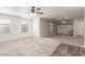 Spacious bedroom with neutral carpet, two windows, and a ceiling fan with lighting at 209 Eucalyptus Ln, Mesquite, NV 89027